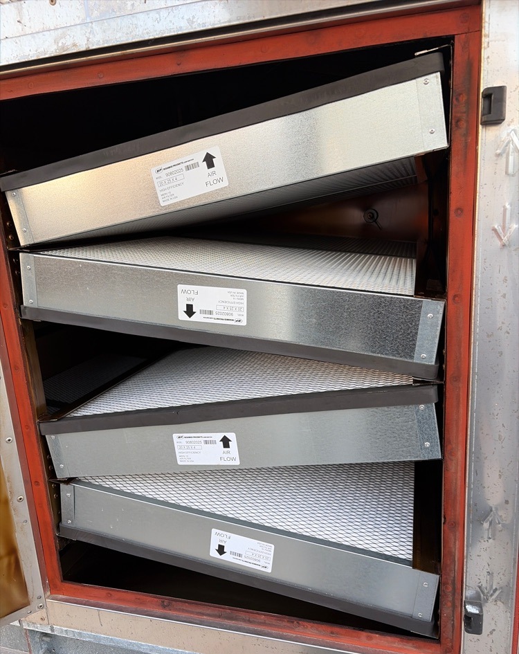 The same pollution control unit with clean replacement filters installed