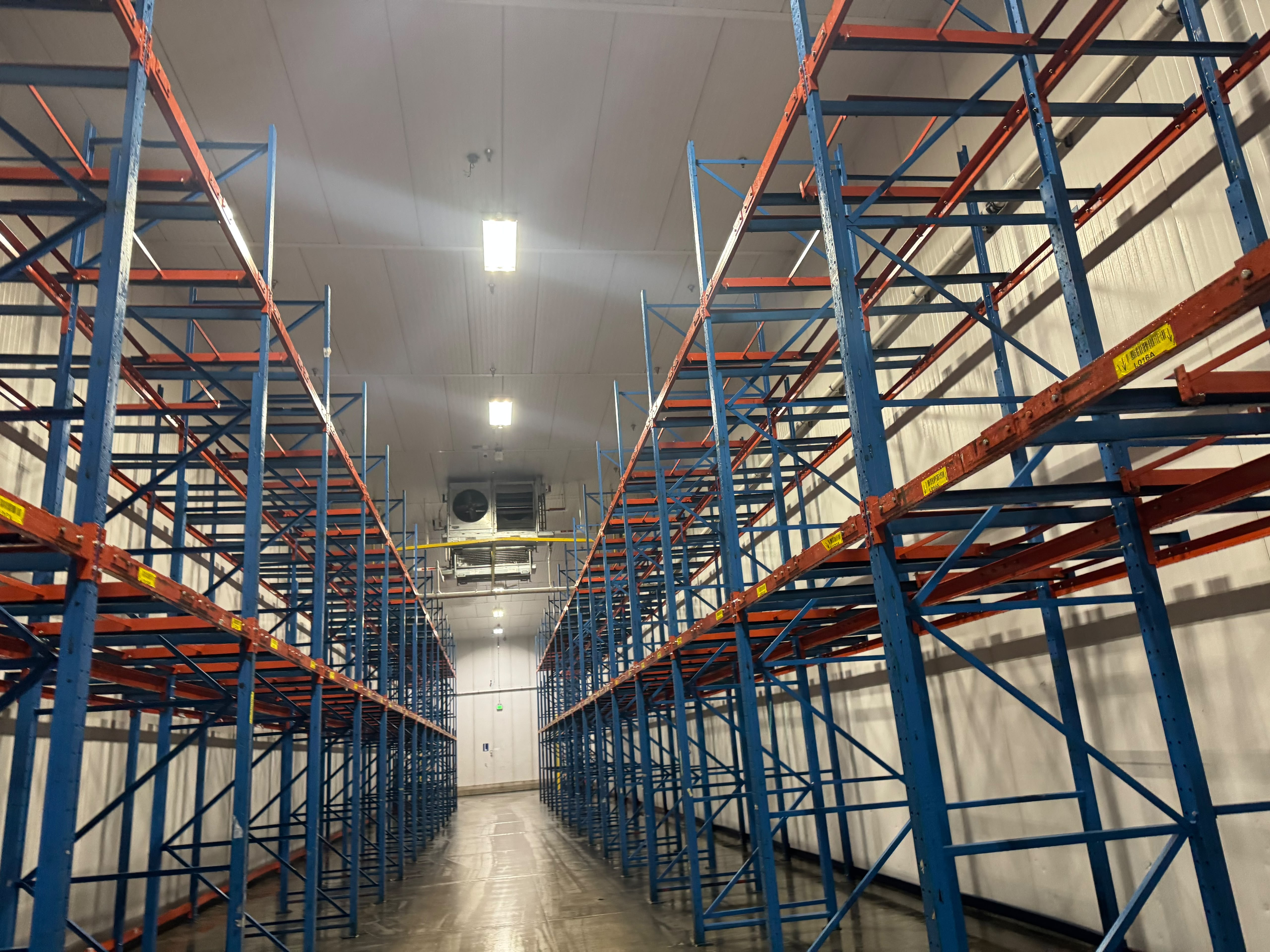 Refrigerated warehouse cooler after cleaning, with a clean finished floor