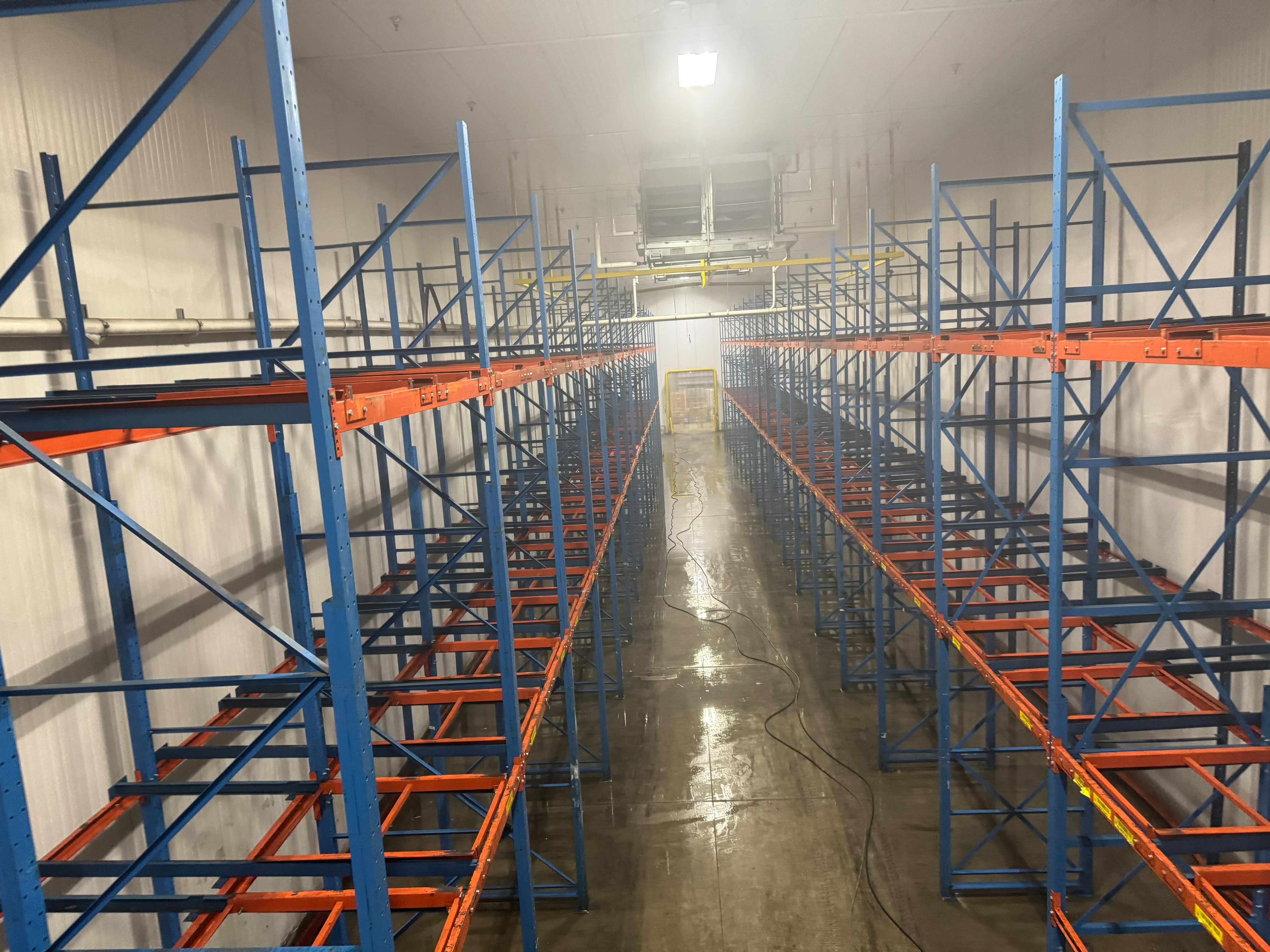 Refrigerated warehouse cooler floor during cleaning